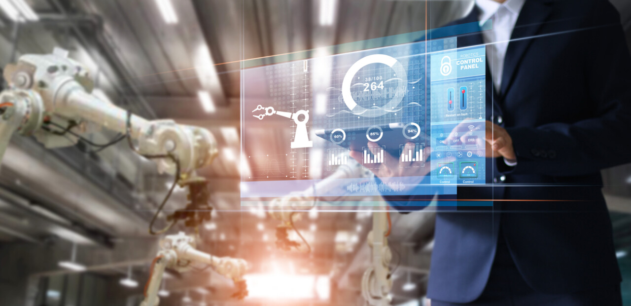 Manager industrial Engineer using tablet check and control automation robot arms machine in intelligent factory industrial over system on virtual interface screen, Industry 4.0 concept